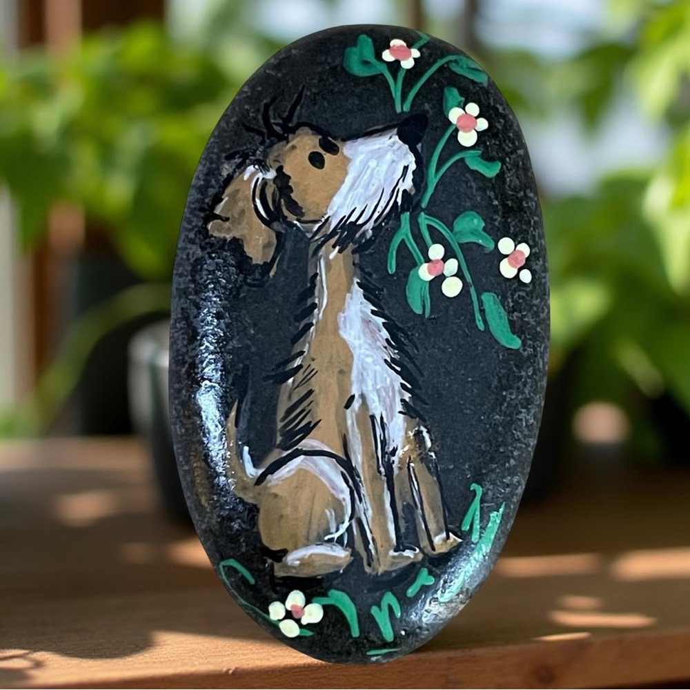 Hand crafted painted dog black rock brown white puppy 2x1.5 inches approx floral